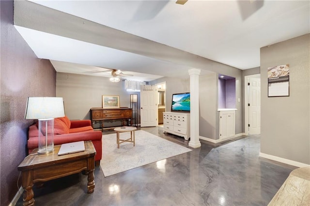 living room featuring ceiling fan, concrete floors, and ornate columns