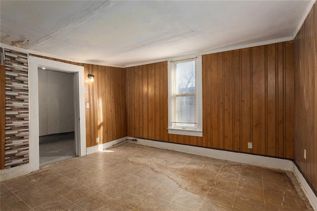 empty room featuring wood walls