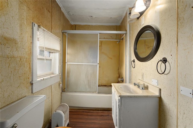 full bathroom with toilet, crown molding, shower / bath combination with glass door, vanity, and hardwood / wood-style floors