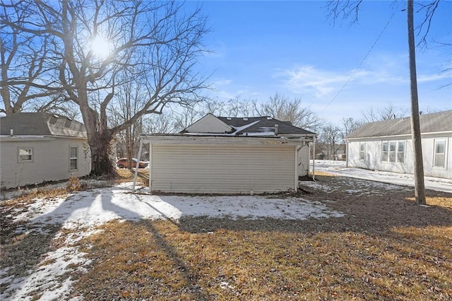 view of snow covered garage