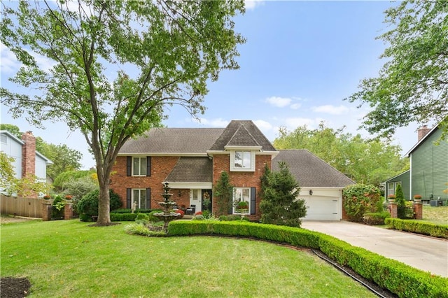 view of front of house featuring a garage and a front lawn