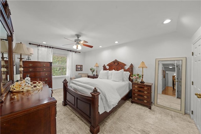 bedroom with light carpet and ceiling fan