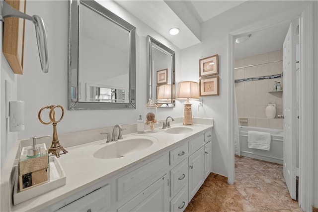 bathroom with shower / tub combo and vanity