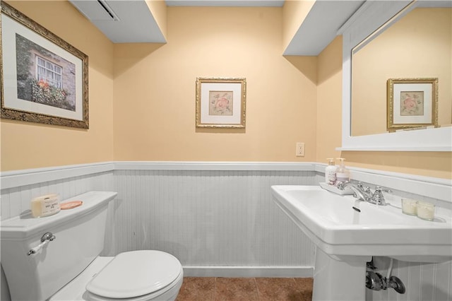 bathroom featuring tile patterned flooring and toilet