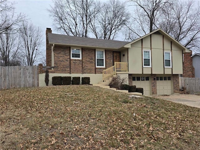 view of front of home with a garage and a front lawn