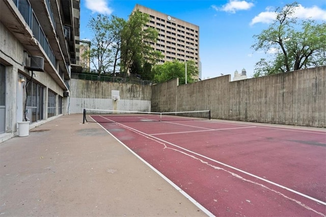 view of sport court featuring community basketball court and fence