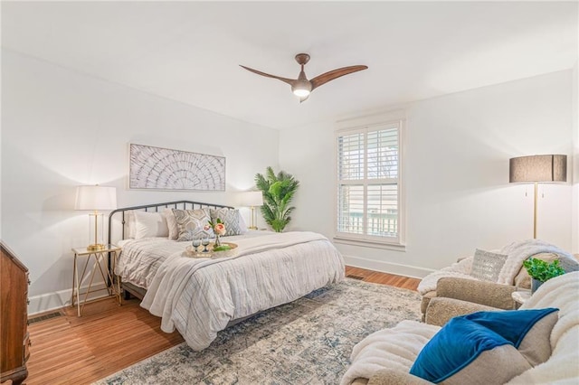 bedroom featuring wood-type flooring and ceiling fan