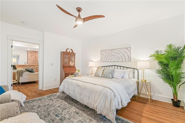 bedroom with hardwood / wood-style flooring and ceiling fan