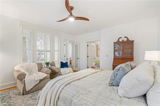 bedroom with ceiling fan and light hardwood / wood-style flooring