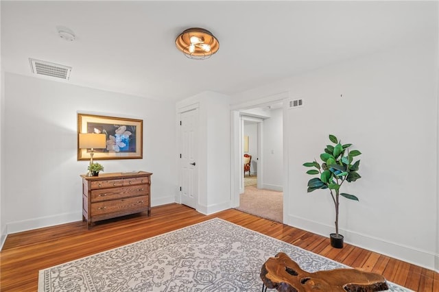 living area with wood-type flooring