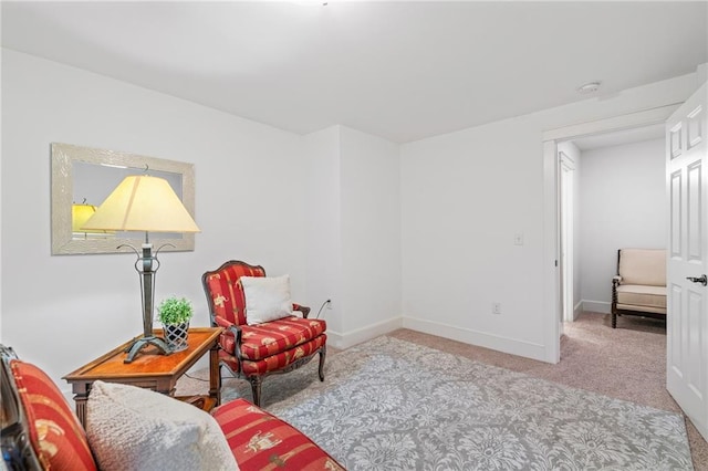 living area featuring light colored carpet