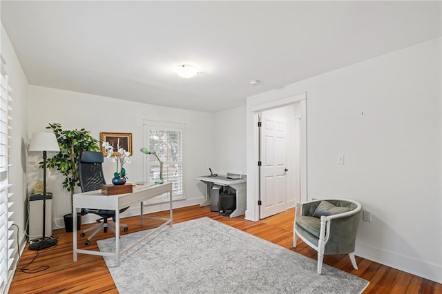 home office with hardwood / wood-style flooring