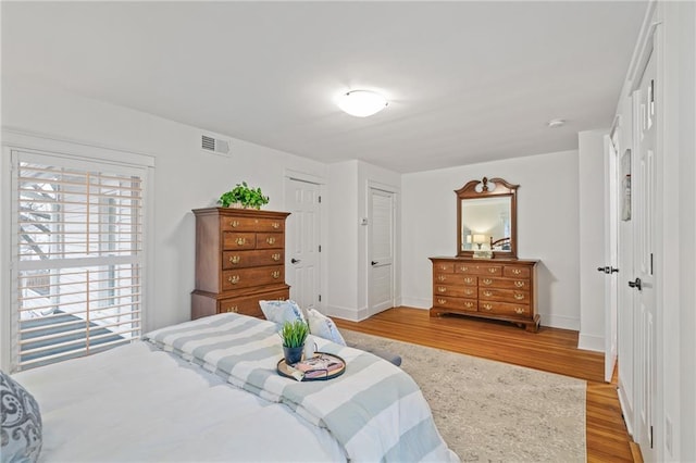 bedroom featuring a closet and light wood-type flooring