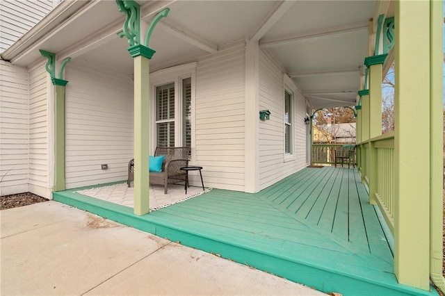 wooden deck featuring a patio area