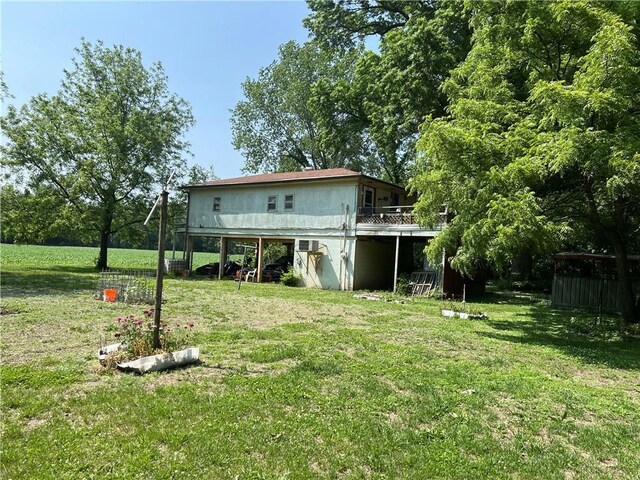 5811 Frederick Blvd, Saint Joseph, MO 64507 - rear view of house featuring a yard and a wooden deck