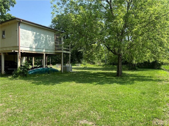5811 Frederick Blvd, Saint Joseph, MO 64507 - view of grassy yard with a wooden deck