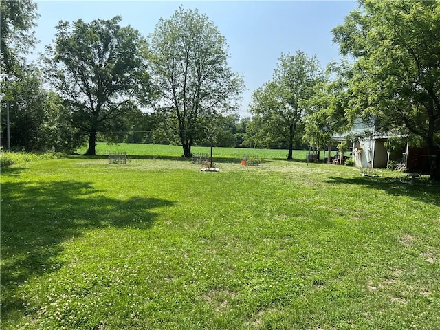 5811 Frederick Blvd, Saint Joseph, MO 64507 - view of grassy yard featuring an outdoor structure