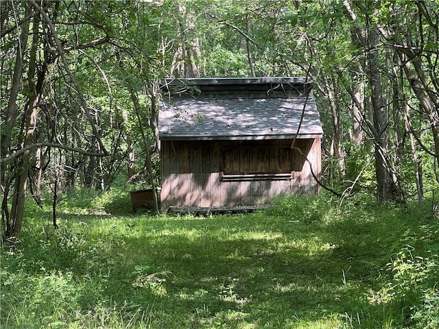 5811 Frederick Blvd, Saint Joseph, MO 64507 - view of side of property featuring an outdoor structure and a forest view