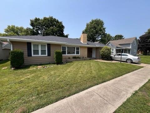 ranch-style house with a front yard