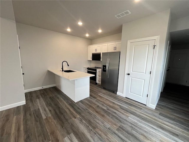 kitchen with stainless steel refrigerator with ice dispenser, sink, white cabinetry, electric range oven, and kitchen peninsula