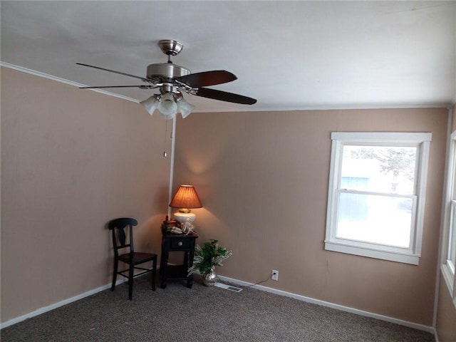 unfurnished room featuring ornamental molding and carpet