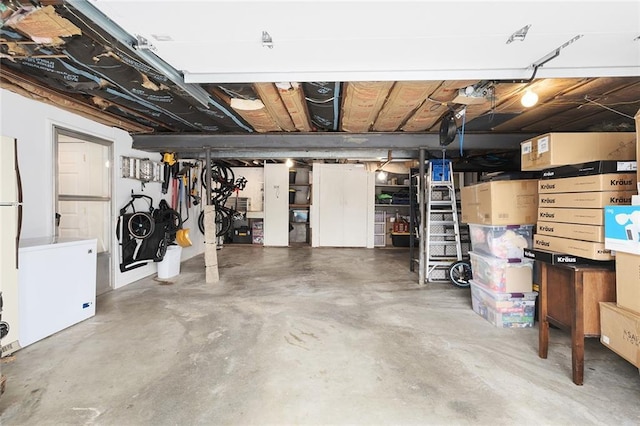 garage featuring white refrigerator and fridge