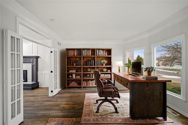 home office featuring crown molding, dark hardwood / wood-style floors, and french doors