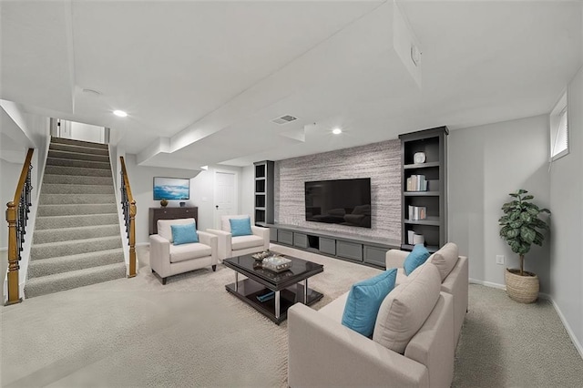 carpeted living room with built in shelves