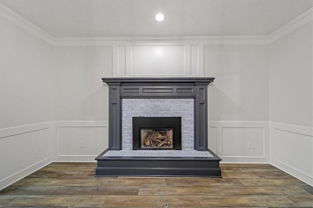 interior details with crown molding, a fireplace, and hardwood / wood-style flooring