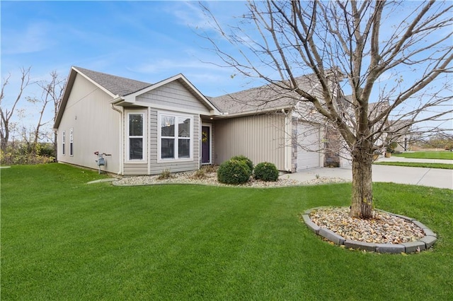 view of front facade featuring a garage and a front yard