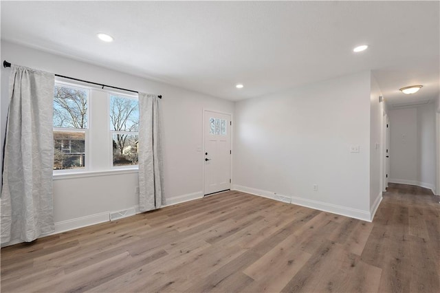 entryway with light hardwood / wood-style floors