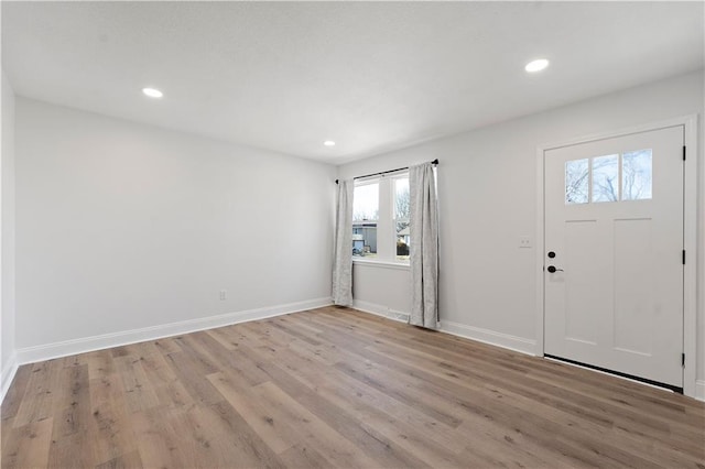 foyer with light hardwood / wood-style floors