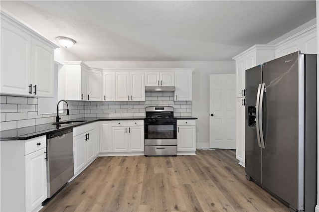 kitchen featuring appliances with stainless steel finishes, sink, and white cabinets