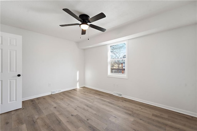 unfurnished room featuring wood-type flooring and ceiling fan