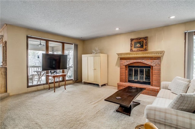 living room with a fireplace, light carpet, and a wealth of natural light