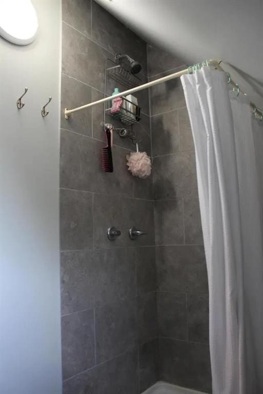 bathroom with a shower with curtain