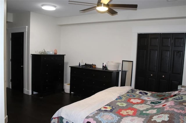 bedroom with hardwood / wood-style floors, ceiling fan, and a closet