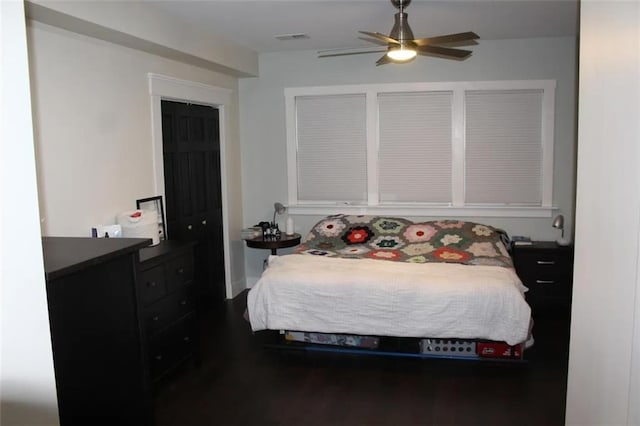 bedroom with ceiling fan and wood-type flooring