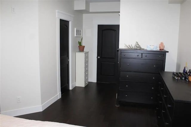 bedroom featuring dark hardwood / wood-style flooring