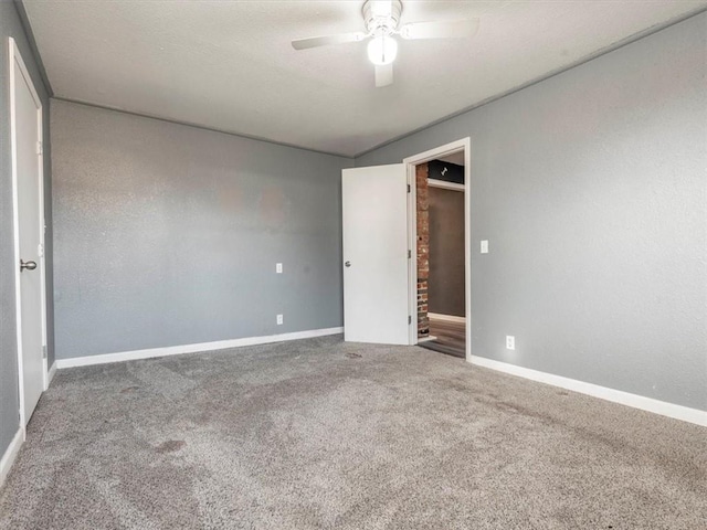 unfurnished bedroom featuring ceiling fan and carpet flooring