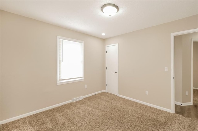 view of carpeted spare room