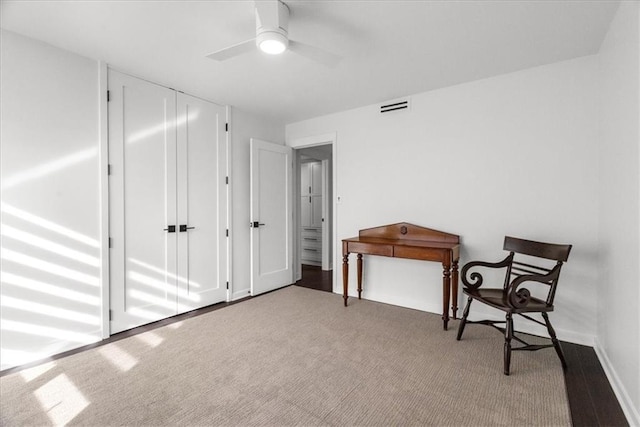 living area with ceiling fan