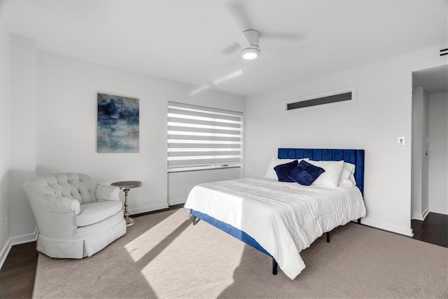 bedroom with ceiling fan and hardwood / wood-style floors