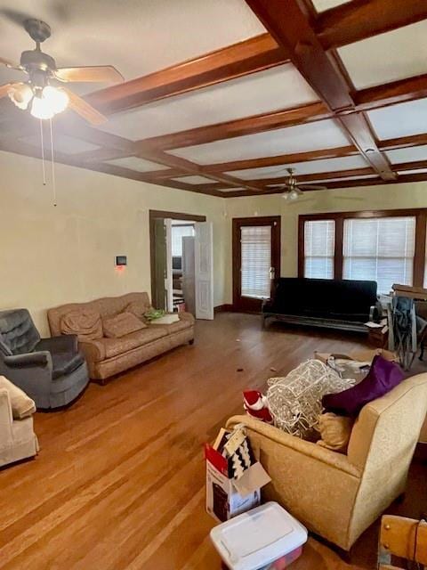 living room featuring coffered ceiling, beam ceiling, wood-type flooring, and ceiling fan