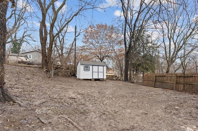 view of yard featuring a storage unit