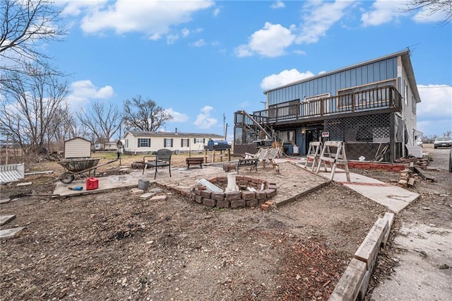 view of yard featuring a fire pit and a deck