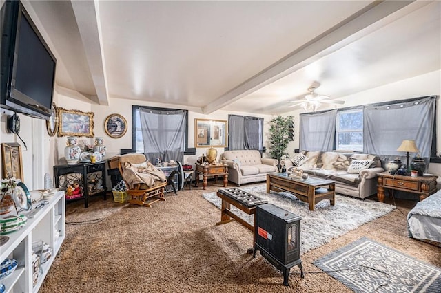 carpeted living room featuring ceiling fan and beam ceiling