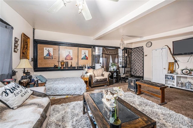 living room with ceiling fan and beam ceiling