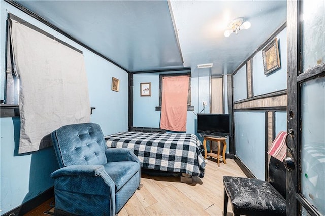 bedroom with light hardwood / wood-style floors