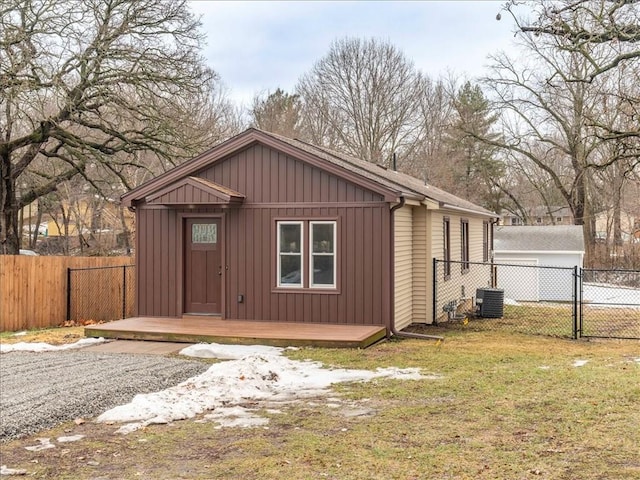 view of outbuilding with a lawn and cooling unit